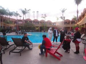 Cosplayers hanging out by the pool