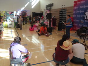 Attendees get read for the paper plane throwing contest